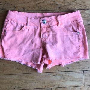 Bright orange Celebrity Pink shorts